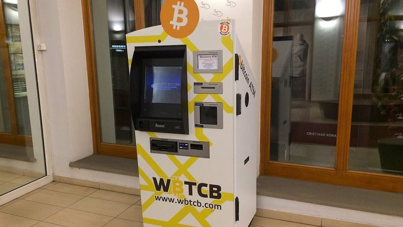 A bitcoin ATM machine in a building lobby